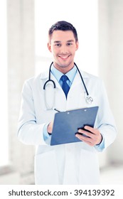 Bright Picture Of Male Doctor Writing Prescription