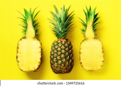Bright pineapple pattern for minimal style. Top View. Pop art design, creative concept. Copy Space. Fresh pineapples on yellow background