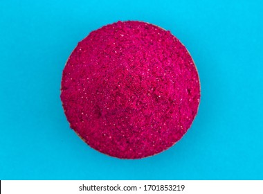 Bright Pink Dragonfruit Powder On A Bright Blue Background