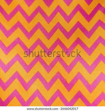 Bright Pink Zigzag Pattern on Yellow Fabric – Vibrant Textile Background