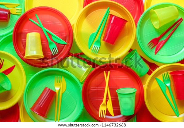 Bright plastic\
disposable tableware\
background