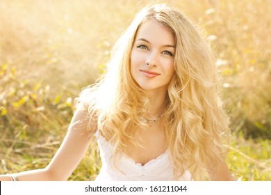 Bright Portrait of Happy Woman at Summer Field