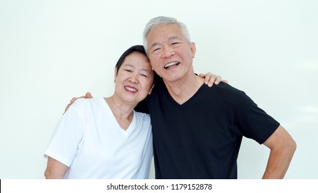 Bright, Positve And Happy Asian Elderly Married Couple On White Background