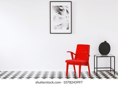 Bright Red Armchair In A Black And White Minimalist Living Room Interior Of An Art Lover