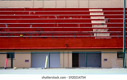 bright red bleachers of tennis field