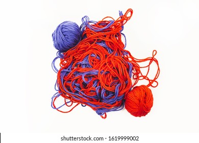 Bright Red And Blue Tangled Threads On A White Background