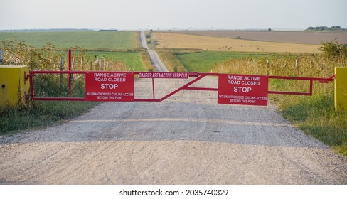 Bright Red Danger Keep Out Signs At The End Of A Track Leading To Army Exercise Restricted Training Areas, UK
