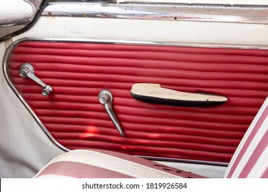 Bright red interior door of a vintage car waiting to be restored. - Powered by Shutterstock