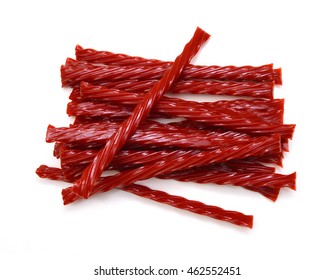 Bright Red Licorice Candy shaped like a twisted rope on white background