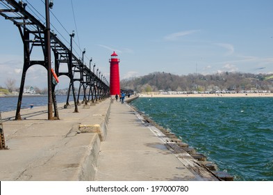 The Bright Red Lighthouse By The Grand Haven Beach