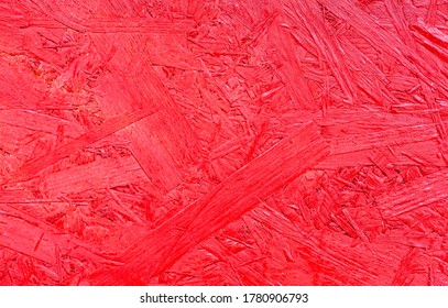 Bright Red Painted Pressed Wooden Textured Bakground, Waferboard Close-up.