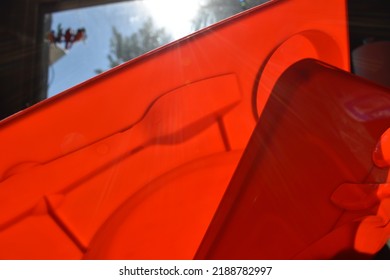 Bright Red Plastic Plate In A Kitchen