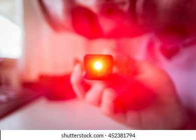 Bright Red Point Light from Looking into Shining Laser