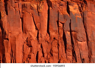 Bright Red Rock Cliff In The Rugged Back-country Of Utah