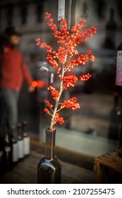 Bright Red Rowan Branch In A Wine Shop Window With Reflections