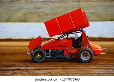 Bright Red Sprint Car Driving Fast