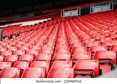 Bright red stadium seat in Liverpool. 
