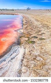 Bright Red Water In The Lake Due To A Red Algae Bloom. 