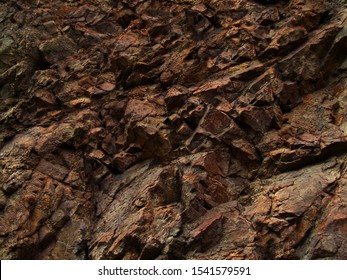     Bright red  brown stone background  Golden rock texture  Mountain close  up    Mountain texture                         