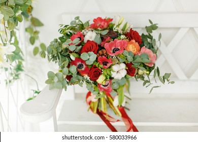 Bright romantic bouquet of flowers with ribbons on a light background - Powered by Shutterstock