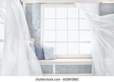 Bright room interior, curtains, white window sill, pillows, plaster.