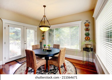 Bright Room With Round Dining Table And Wicker Chairs