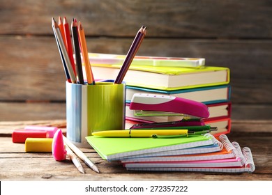 Bright school stationery on old wooden table - Shutterstock ID 272357222
