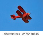 A Bright, Shiny, Red Bi-Plane