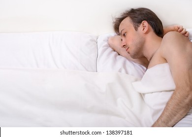 Bright Shoot Of Upset Man Lies In The Bed