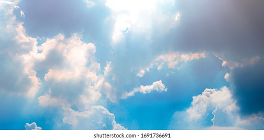 Bright Sky And Clouds With God Ray. Panorama View. Cloudscape