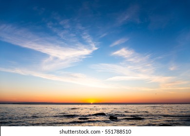 Bright Sky And Water At Sunset Over Baltic Sea Of Tallinn, Estonia