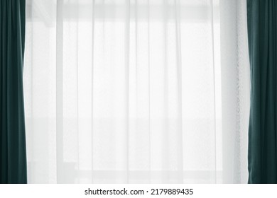 Bright and soft morning light through the white curtain. Home living and interior decoration. luxury background. The windows are decorated in an elegant style. - Shutterstock ID 2179889435