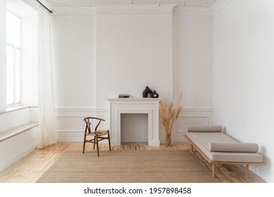 a bright space with white walls, high ceilings and wooden floors.