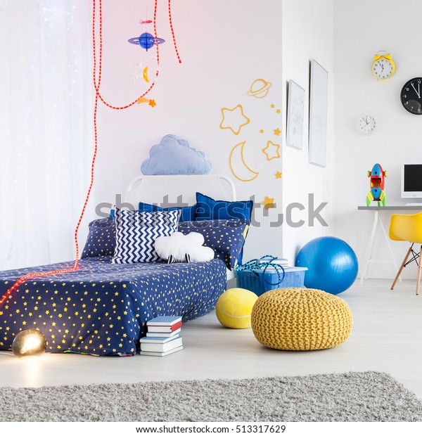 Bright and spacious child room divided into a work\
area and area to sleep