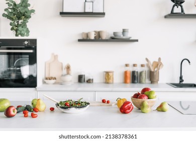 Bright and spacious kitchen interior design. Salad making. Cooking time. Kitchenware and decor on background. Clean cookware. Healthy food concept - Powered by Shutterstock