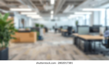 A bright and spacious open plan office interior with modern desks, chairs, and potted plants, creating a productive work environment.