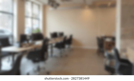A bright and spacious open-plan office interior featuring modern desks, chairs, and natural light.