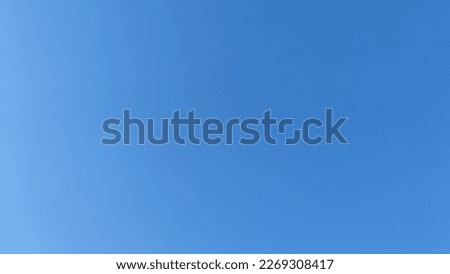 Bright spring sky. Spring day the sky is light blue without clouds. On the left, the sky is slightly lighter on the right, it is darker and more saturated. A rare completely cloudless day.