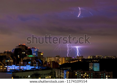 bright strikes of lightning during an evening thunderstorm in Moscow