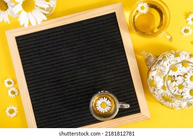 Bright Summer Mock Up. Empty Blank Black Letter Board And Herbal Chamomile Tea On Yellow Background. Mockup Layout Template.