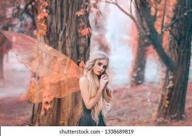 bright summer photo with shining rays of sun, mysterious forest fairy fell in love with prince, girl with puppet face, blond long hair and blue eyes, lady in green dress peeps modestly, with interest.