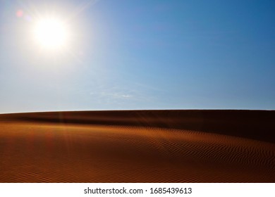 Bright Sun, Clear Blue Sky And Rippled Desert Sand Dune Pattern In The Arabian Desert, Riyadh, Saudi Arabia