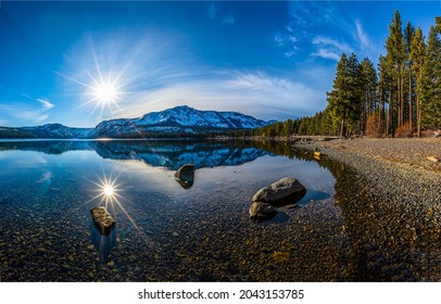 Bright Sun Over A Mountain Lake. Lake Water Reflection