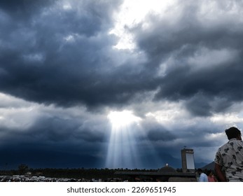 bright sun piercing through the cloud