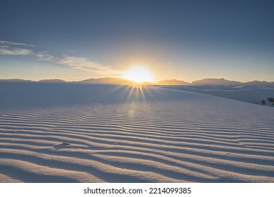 Bright Sun Setting Over White Sands National Park