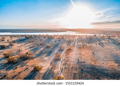 Bright Sun Shining Over Lake In Australian Desert - Aerial View