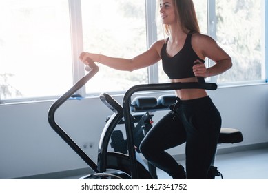 Bright sunlight. Photo of gorgeous blonde woman in the gym at her weekend time. - Shutterstock ID 1417341752