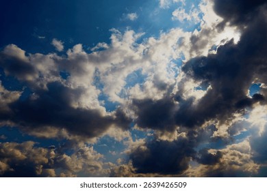 Bright sunlight through clouds creates a 