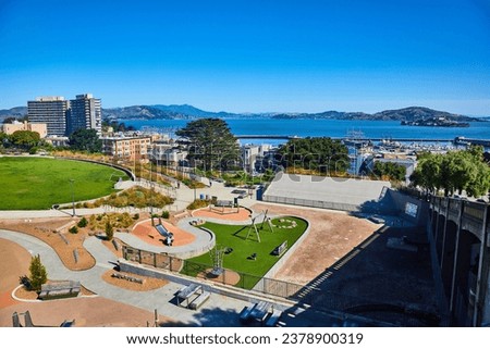Bright and sunny San Francisco Park nearly empty on summer day with the bay and Alcatraz