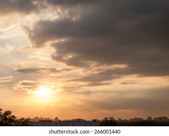 Bright sunset with dramatic cloudscape over skyline 